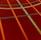 A sports court with intersecting lines in orange and blue, creating geometric patterns on a reddish-brown surface.
